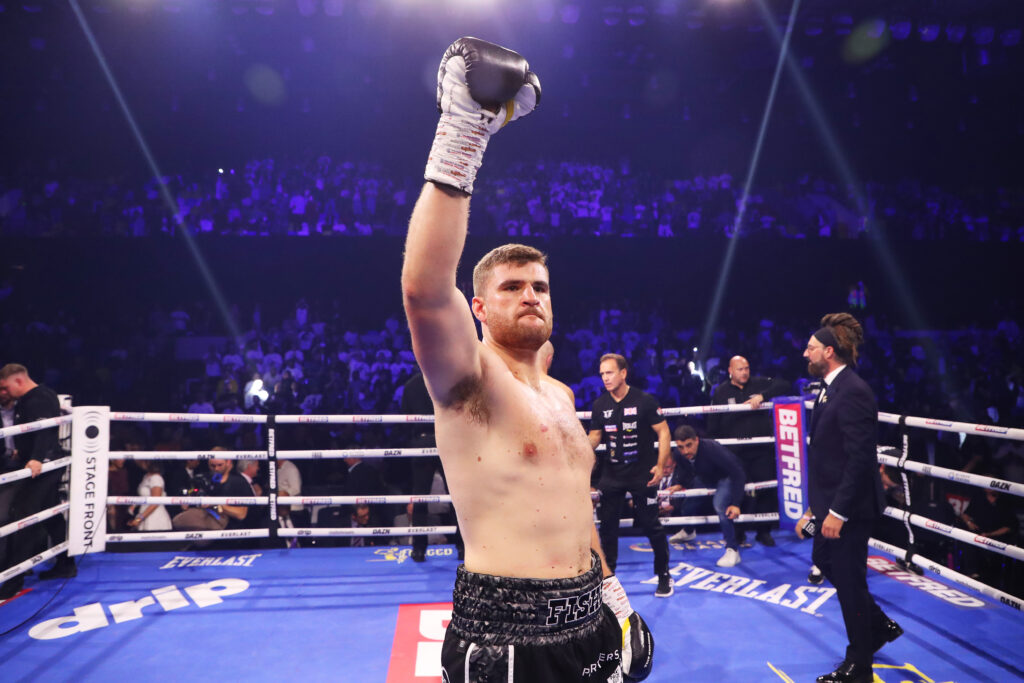 Johnny Fisher celebrates after defeating Alen Babic