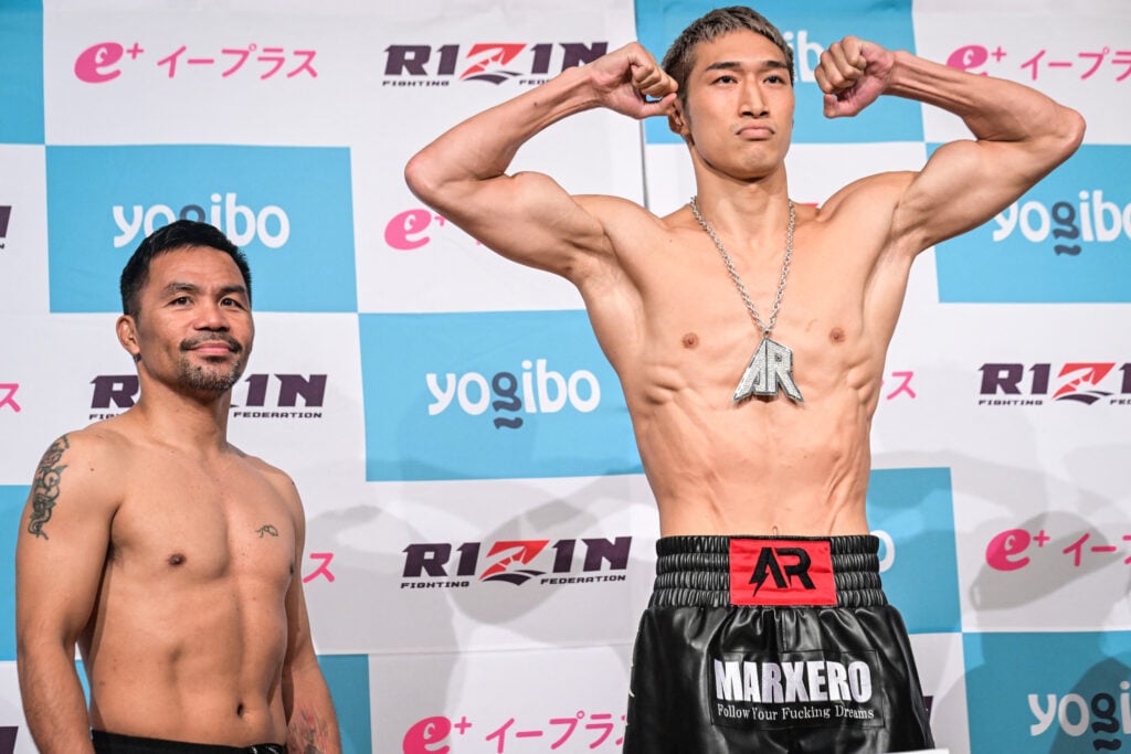Manny Pacquiao stood beside a flexing Rukiya Anpo ahead of their fight