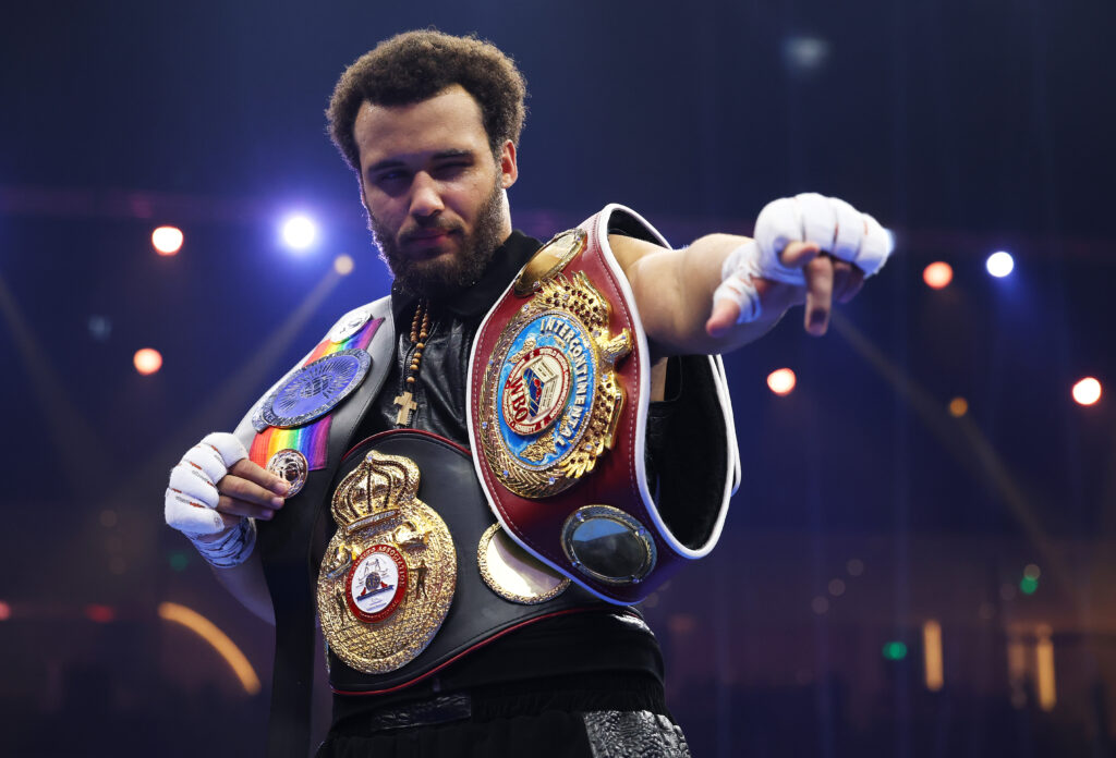 Moses Itauma with his belts after a win
