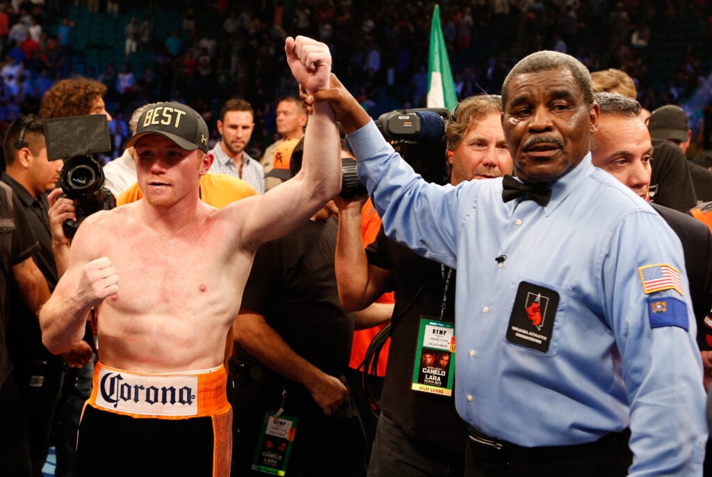 Canelo Alvarez gets his hand raised after a win over Erislandy Lara