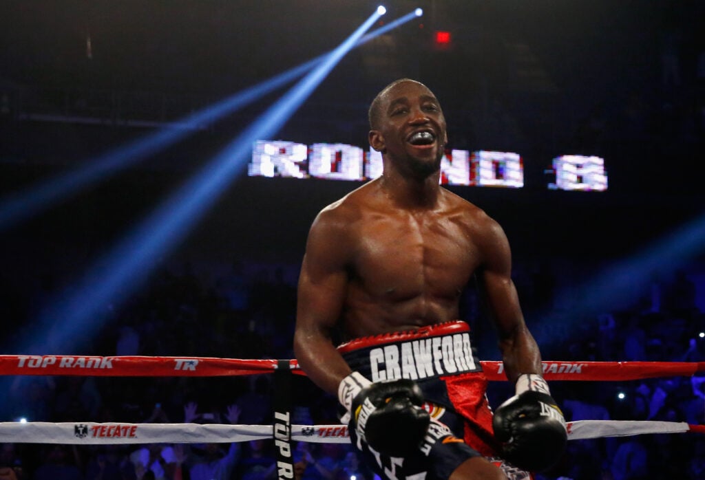 Terence Crawford celebrates with over Thomas Dulorme
