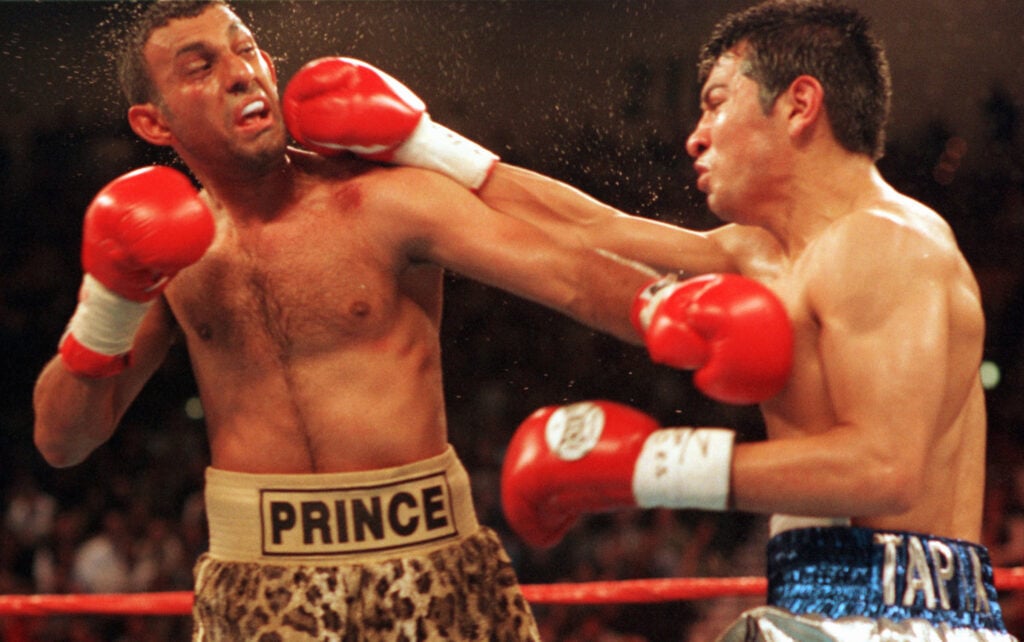 Marco Antonio Barrera punching Prince Naseem Hamed