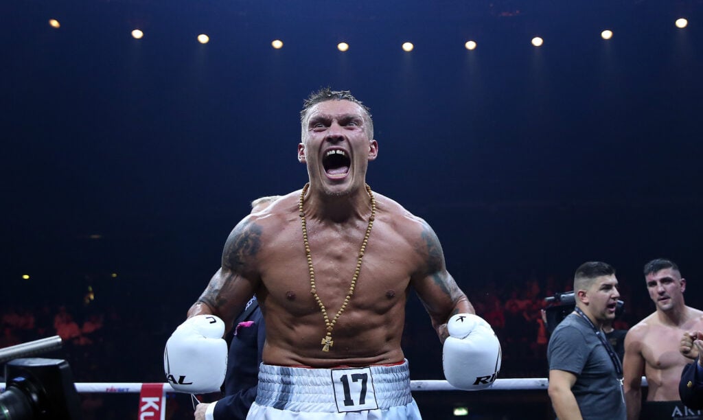 Oleksandr Usyk screams as he celebrates defeating Marco Huck
