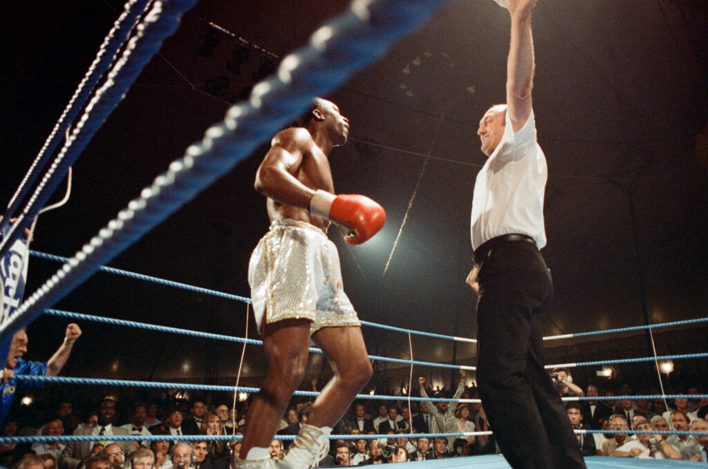 Nigel Benn loses to Michael Watson