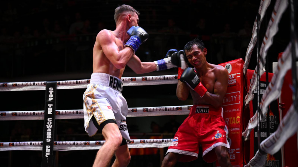 Sam Rennie punching his opponent