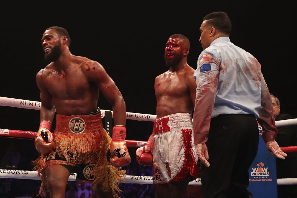 Marcus Browne walks away from a smirking Badou Jack who is covered in blood after horror cut emerged on his head