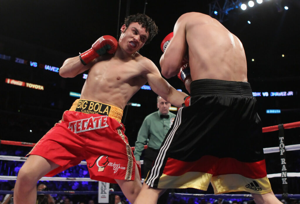 Julio Cesar Chavez Jr. punches Sebastian Zbik during their WBO middleweight title bout