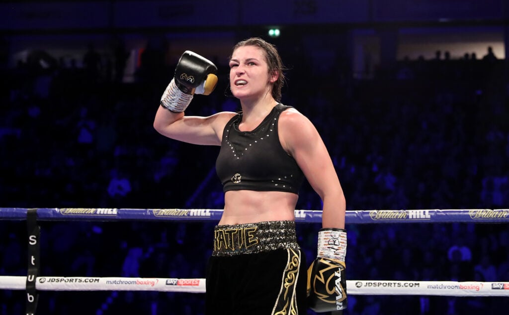 Katie Taylor celebrates win over Christina Linardatou with one hand in the air