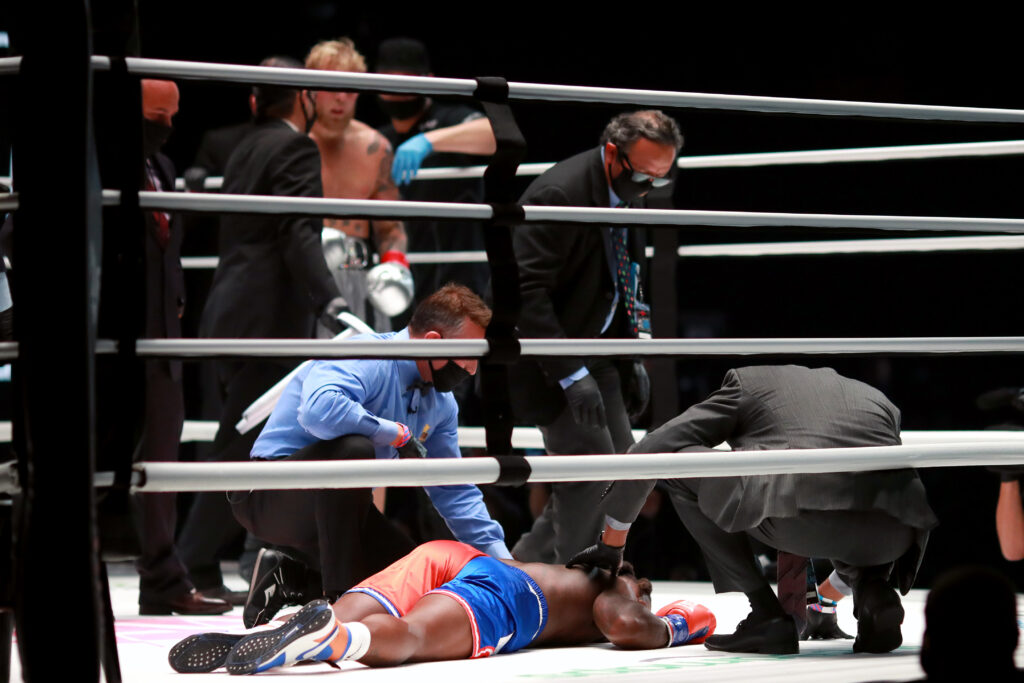 Nate Robinson lays flat on the canvas after Jake Paul knocks him out in their boxing match