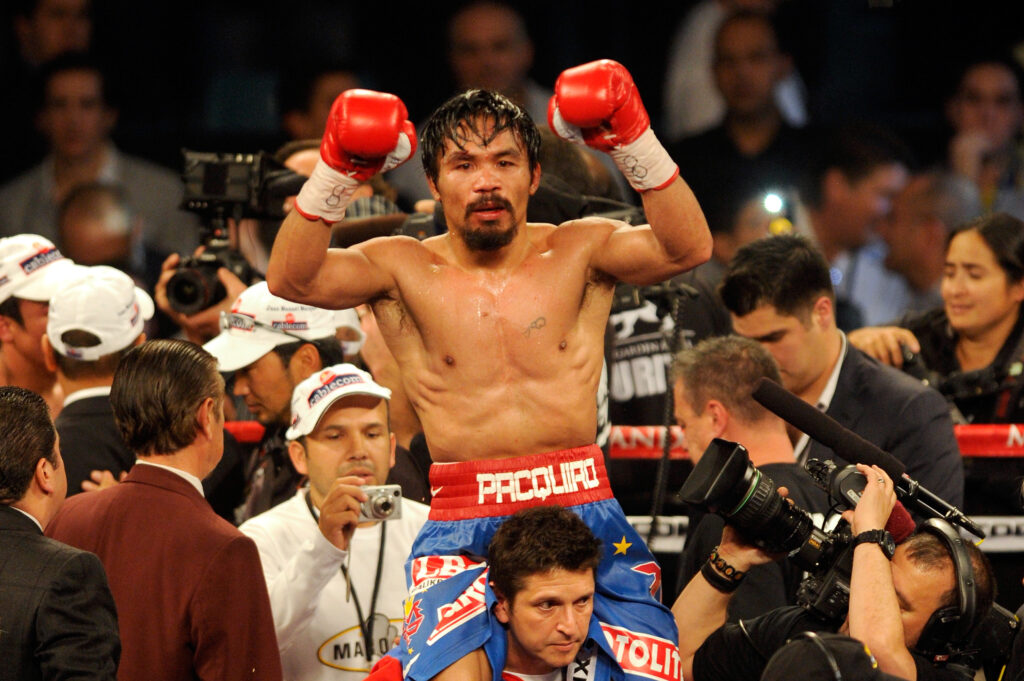Manny Pacquiao celebrates defeating Juan Manuel Marquez
