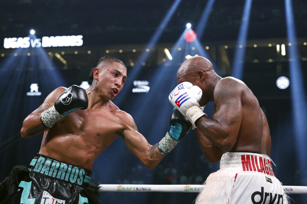 Mario Barris landing a left uppercut on Yordenis Ugas' face as Ugas tries to cover up