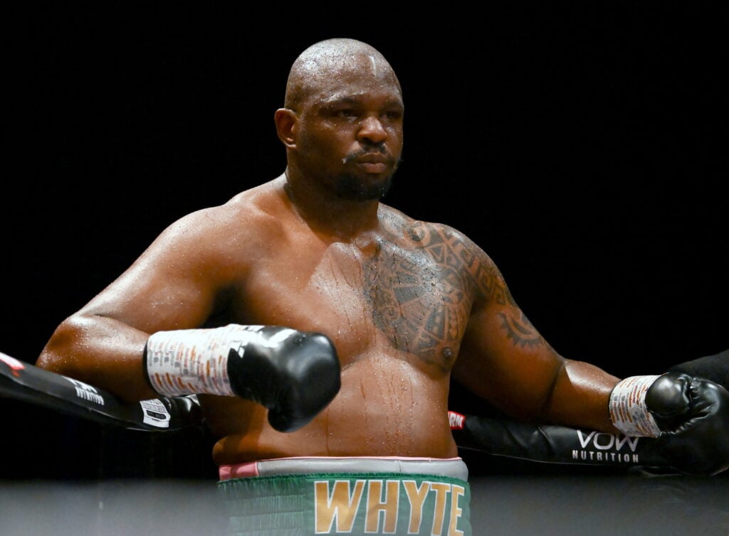 Dillian Whyte looking relaxed while leaning on ropes in ring