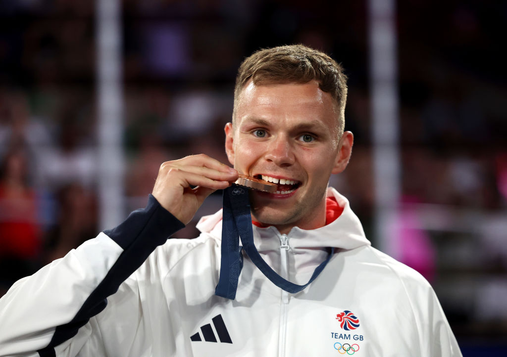 Lewis Richardson bites his Olympic bronze medal