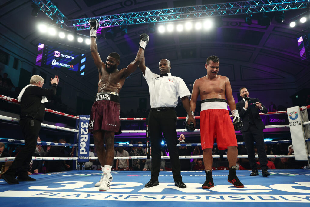 Elliot Elimasi has his hands raised as he beats Jairo Nustes in his pro debut.