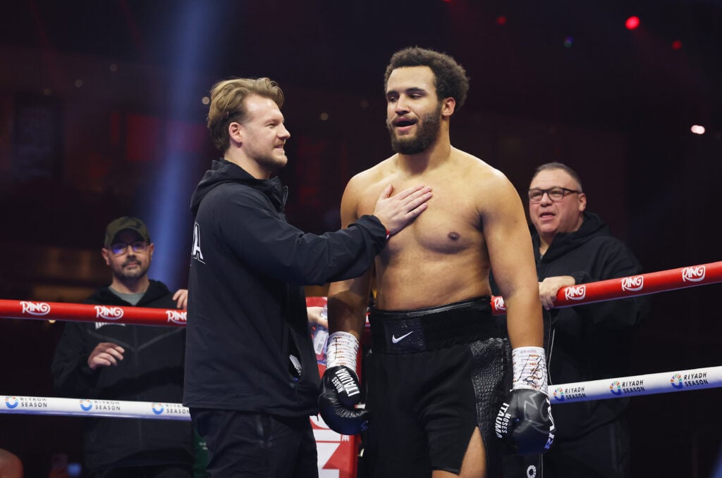 Moses Itauma with trainer Ben Davison who has his hand placed on Itauma's chest