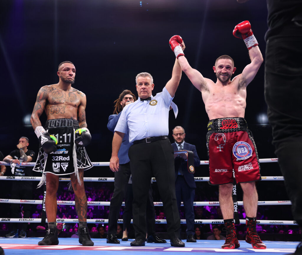 Jazza Dickens has his hand raised against Zelfa Barratt