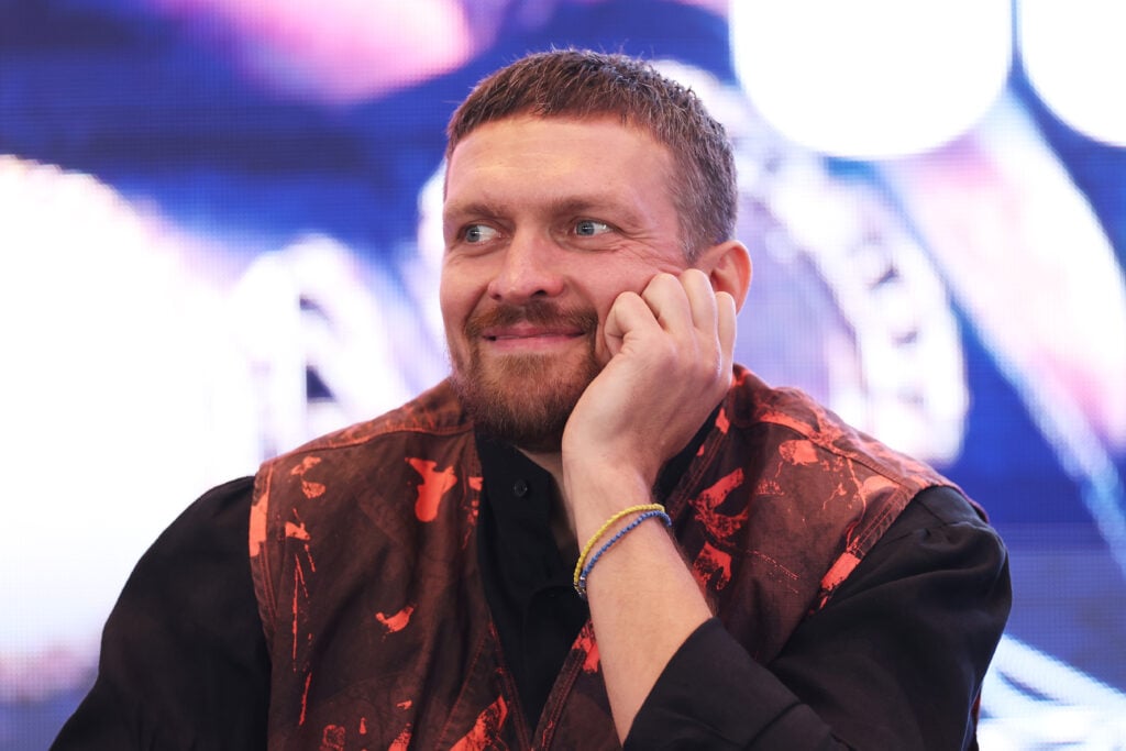 Oleksandr Usyk smirking at press conference for his fight with Daniel Dubois