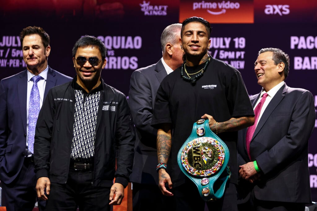 Manny Pacquiao and Mario Barrios pose at press conference, as Barrios holds his WBC world title