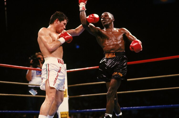 1989: Julio C Chavez lands a punch during a fight against Mayweather. Mandatory Credit: Holly  Stein  /Allsport