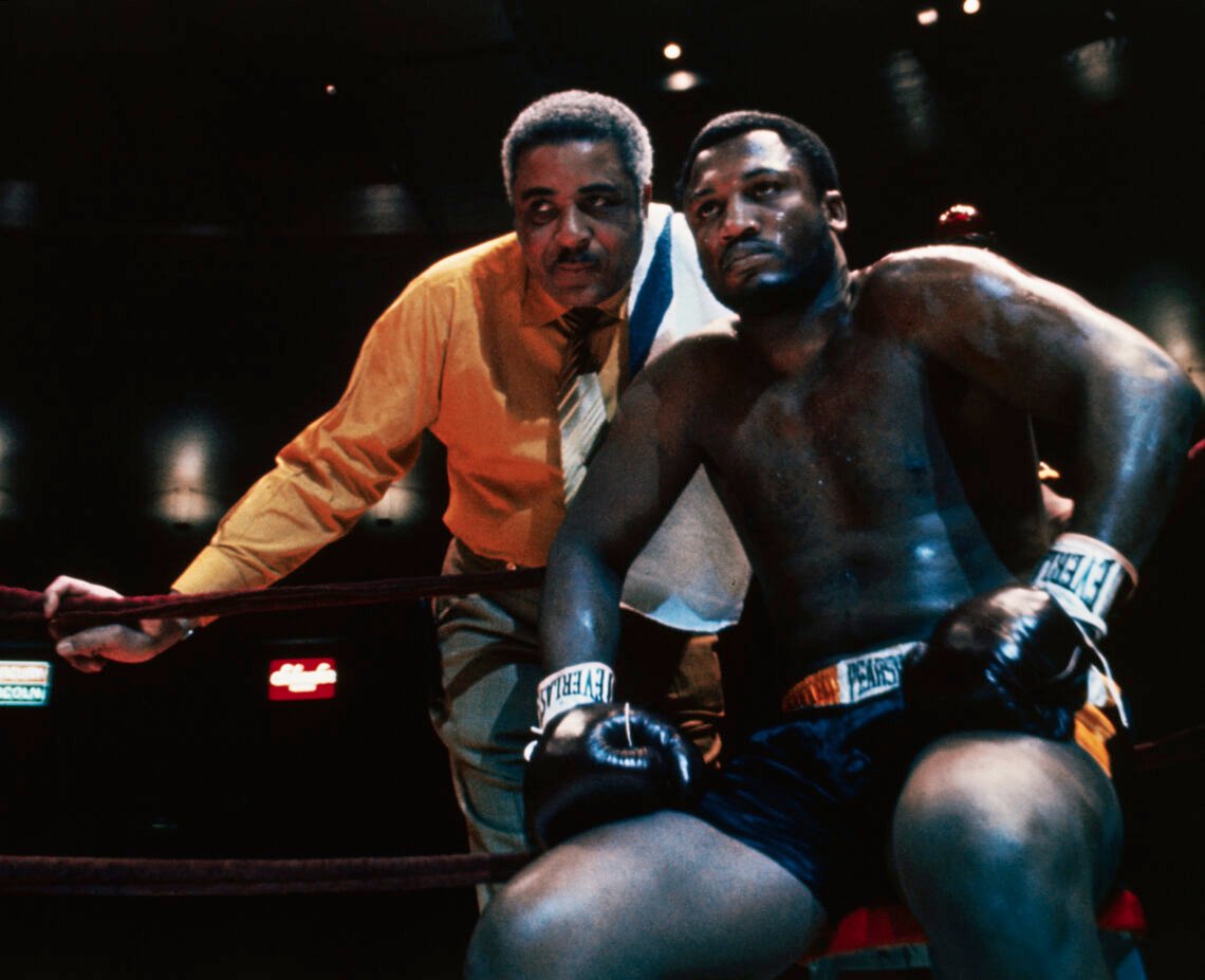 (Original Caption) Heavyweight contender Joe Frazier is shown in the ring with his manager and trainer Yank Durham prior to signing for a bout with...