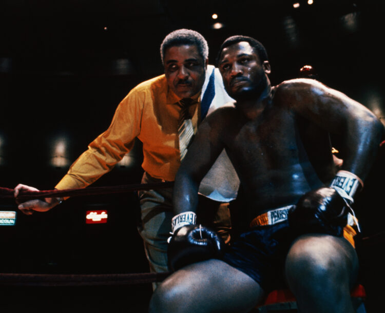 (Original Caption) Heavyweight contender Joe Frazier is shown in the ring with his manager and trainer Yank Durham prior to signing for a bout with...