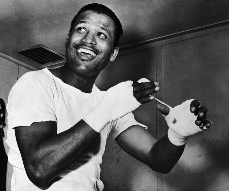 (Original Caption) Middleweight Champion, Sugar Ray Robinson, who defends his crown against Gene Fullmer at Madison Garden December 12th, is shown ...