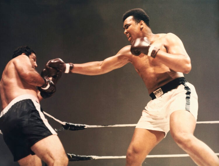 Heavyweight champions Muhammad Ali and Rocky Marciano boxing in composited film created in 1970.