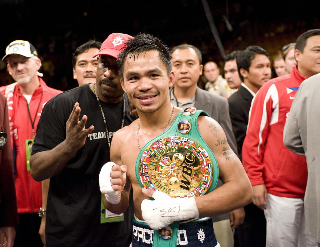 Manny Pacquiao celebrates defeating David Diaz