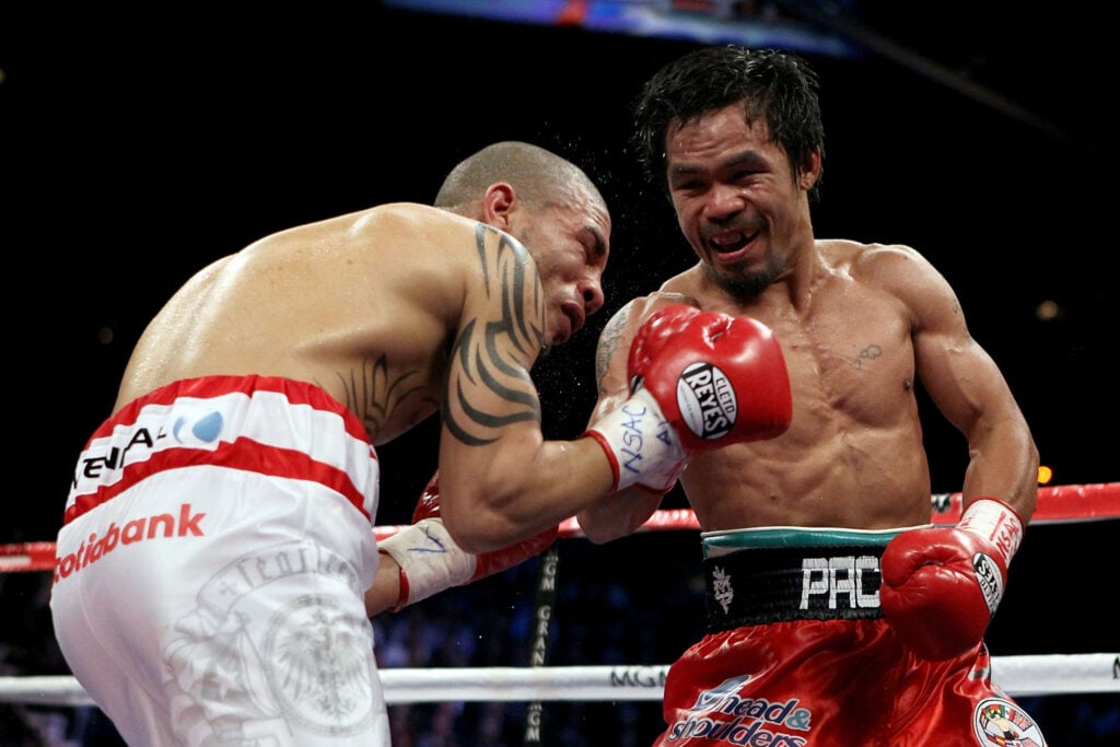 Manny Pacquiao lands a right to the body against Miguel Cotto during their 200 9 fight