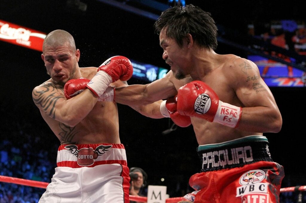 Manny Pacquiao hits a right jab into the chin of Miguel Cotto as Cotto pulls away in their 2009 fight