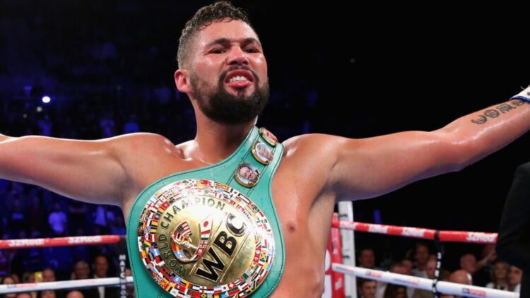 Tony Bellew with arms outstretched and a belt over his shoulder after beating BJ Flores