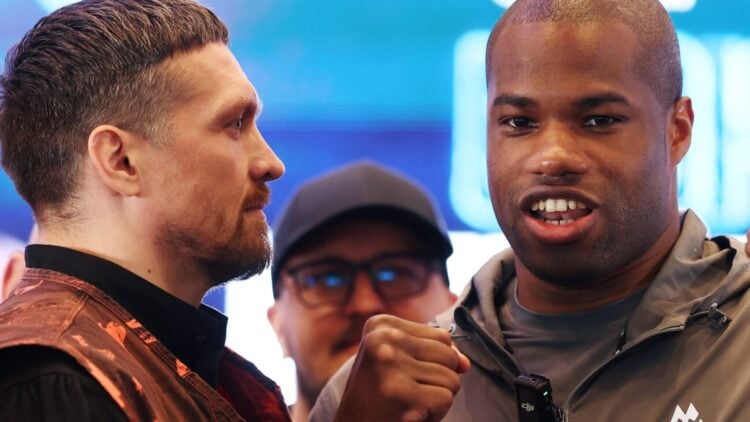 Close up of Oleksandr Usyk staring at Daniel Dubois who faces the camera