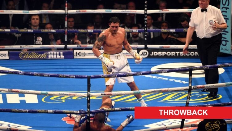 Oleksandr Usyk stands over Tony Bellew after knocking him out in Manchester in 2018