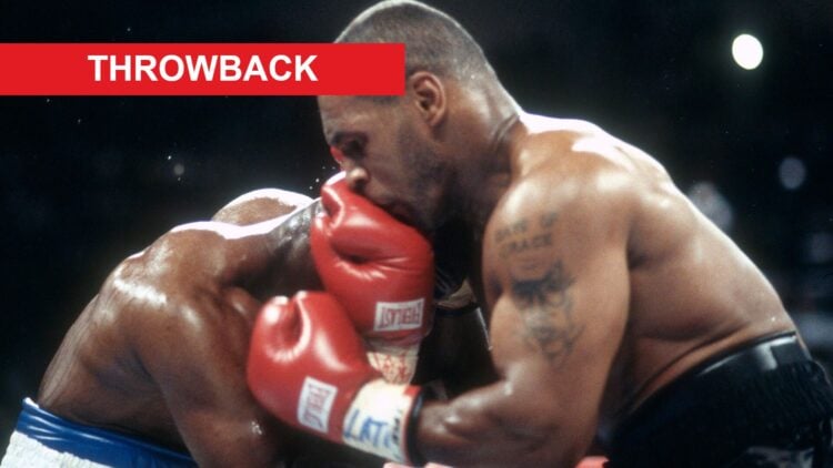 Mike Tyson's head connect with Evander Holyfield's glove during their 1997 fight with a red rectangle in the top left hand corner labelled "throwback"