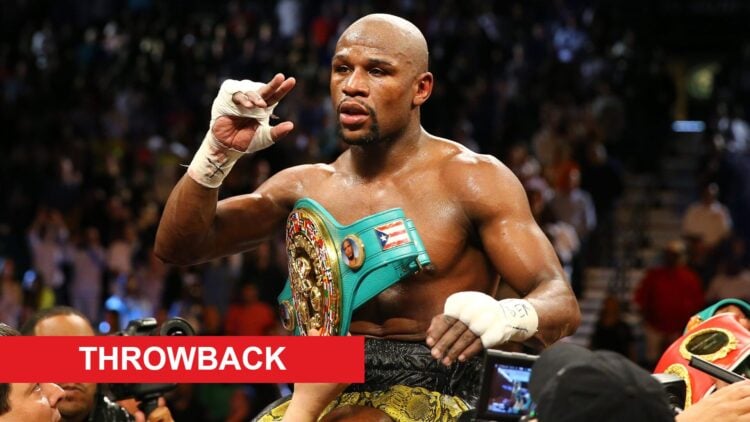 Floyd Mayweather Jr. flexing his belts after a win over Robert Guerrero