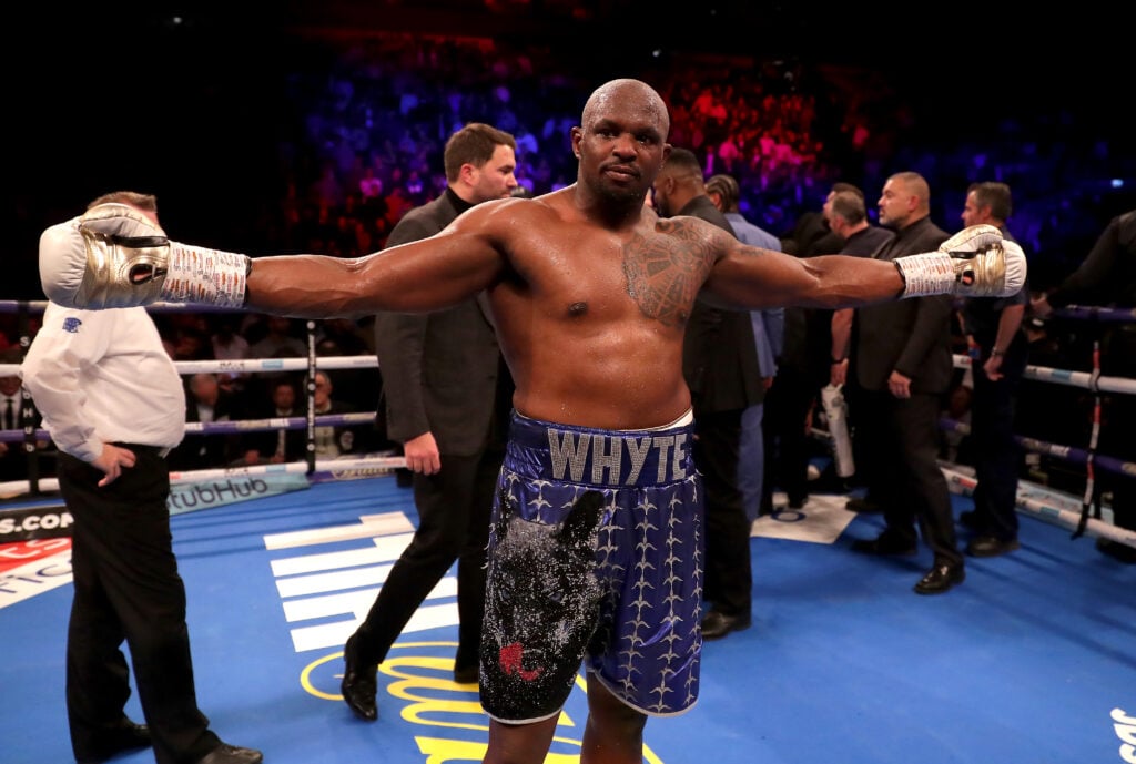 Dillian Whyte celebrates beating Derek Chisora in their rematch