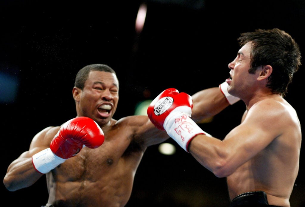Shane Mosley throws a straight left hand at Oscar De LaHoya to Claim WBC and WBA 154-Pound Titles