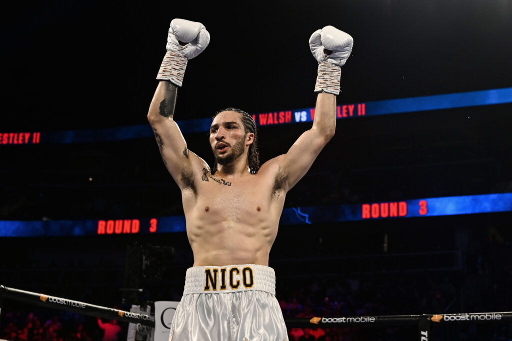 Nico Ali Walsh raises his hands to celebrate a win over James Westley