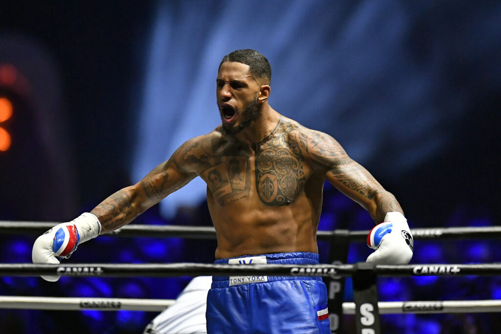 Tony Yoka shouting with his arms wide after beating Johann Duhaupas
