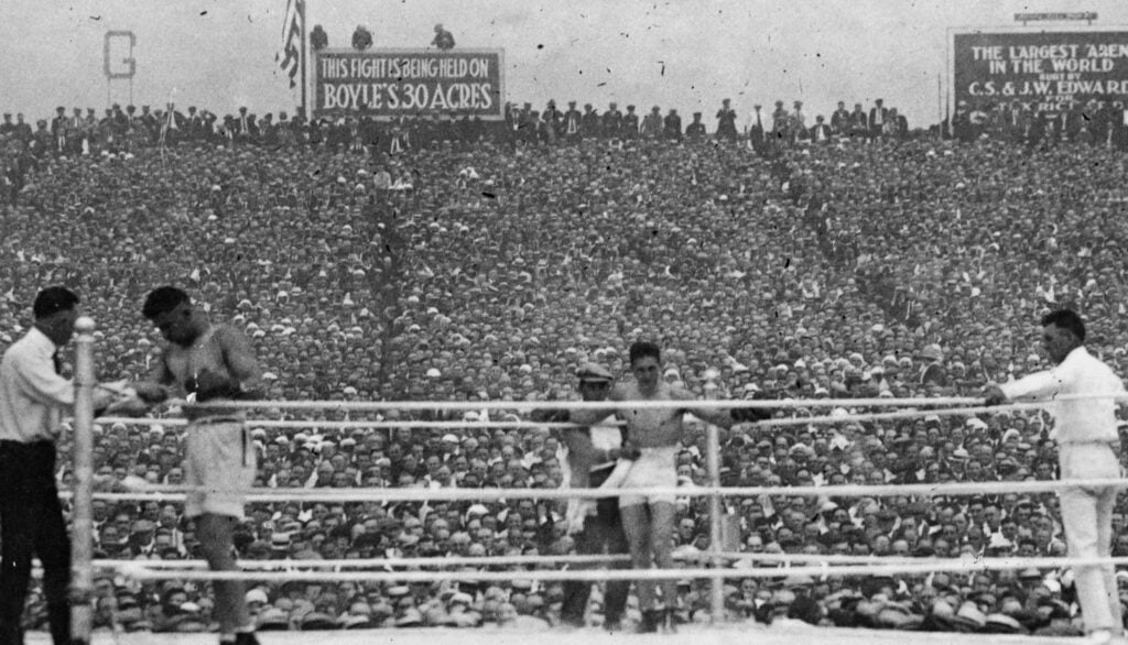 Jack Dempsey and Georges Carpentier rest in their corners in between rounds of their heavyweight fight