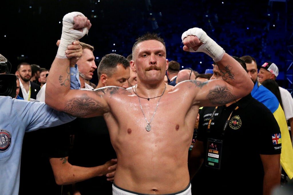 Oleksandr Usyk gets his hand raised in victory by referee following fight