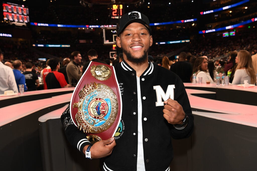 Brian Norman Jr. posing and smiling with his WBO belt