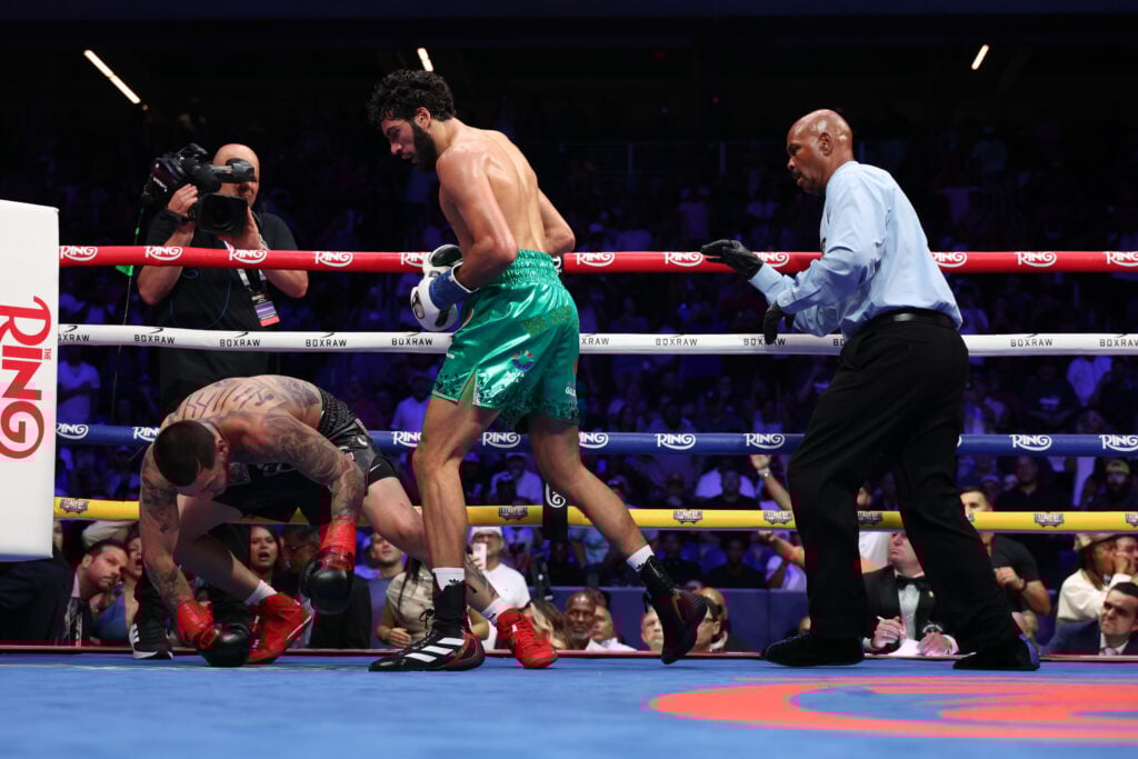 Hamzah Sheeraz stands over Edgar Berlanga who is on the canvas