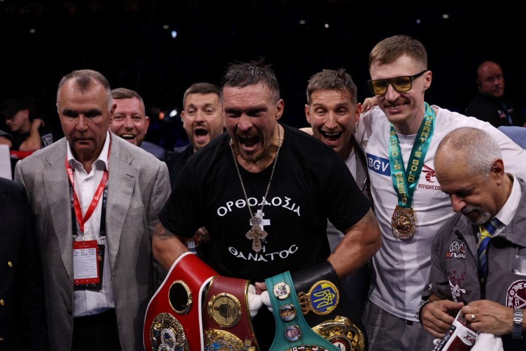 Oleksandr Usyk celebrates after defeating Daniel Dubois