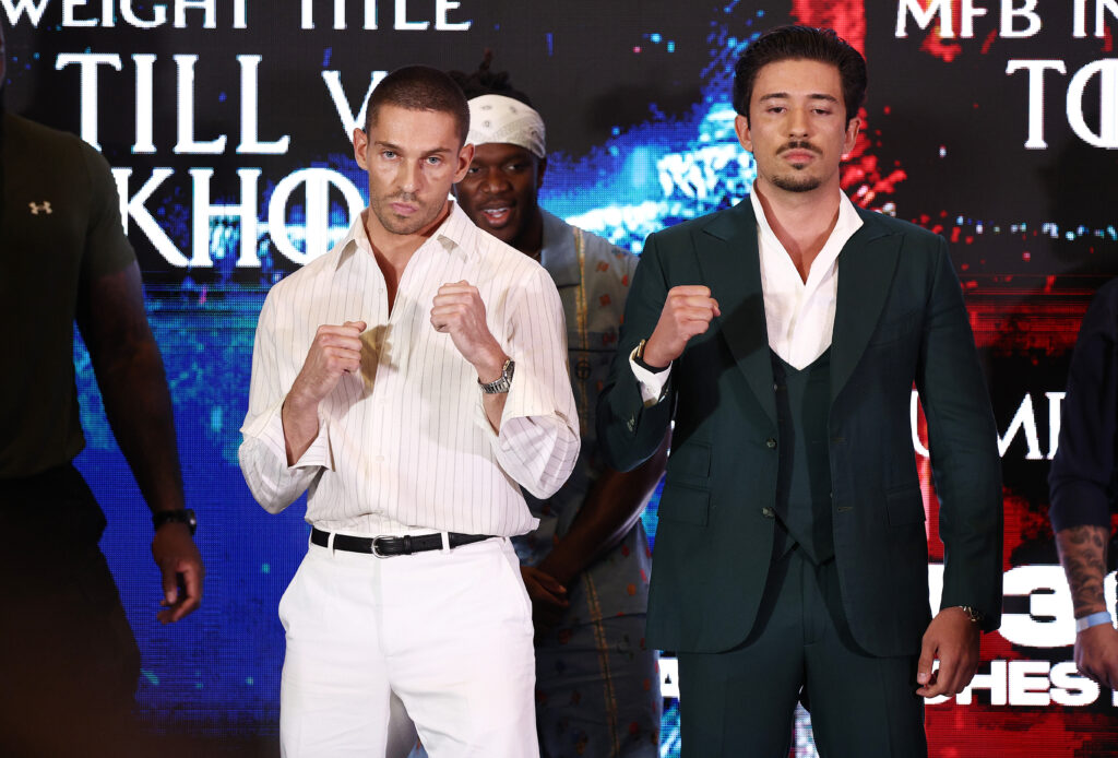 Joey Essex poses with his fists up beside Numeiro ahead of their fight
