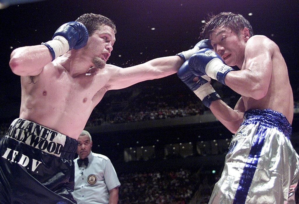 Julien Lorcy punches Takanori Hatakeyama with a left jab as the Japanese fighter tries to block during their 2001 fight.