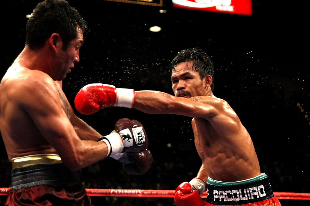Manny Pacquiao throws a right jab at a tired-looking Oscar De La Hoya during their 2008 "dream match"