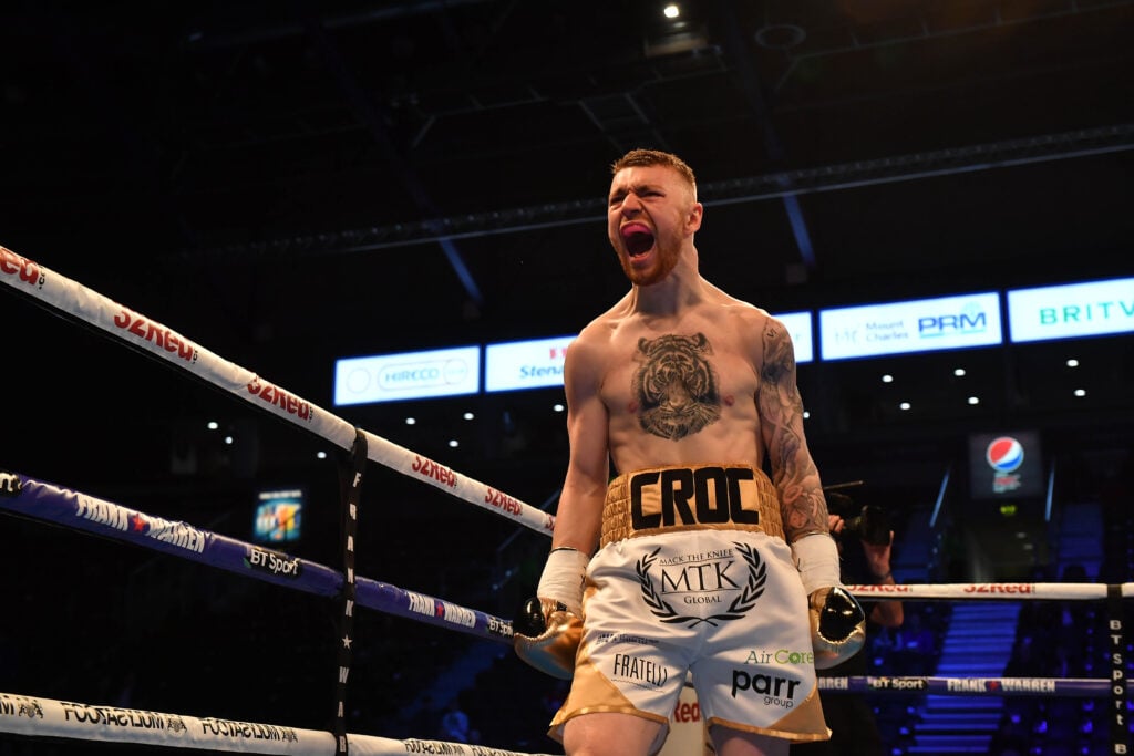 Lewis Crocker screams as he celebrates defeating Gyula Rozsas