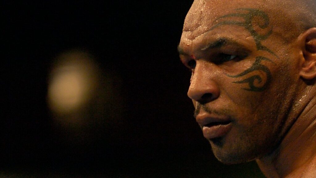 Close-up of Mike Tyson's side profile with his tattoo on show