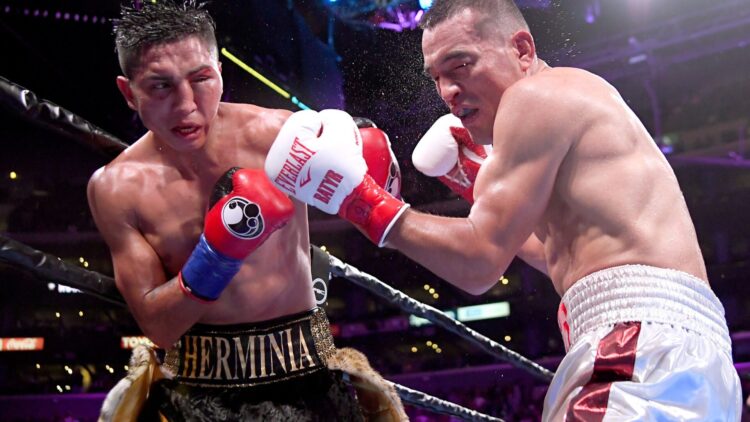 Mario Barrios, who has a swollen eye, lands a left hook on the face of Batyr Akhmedov